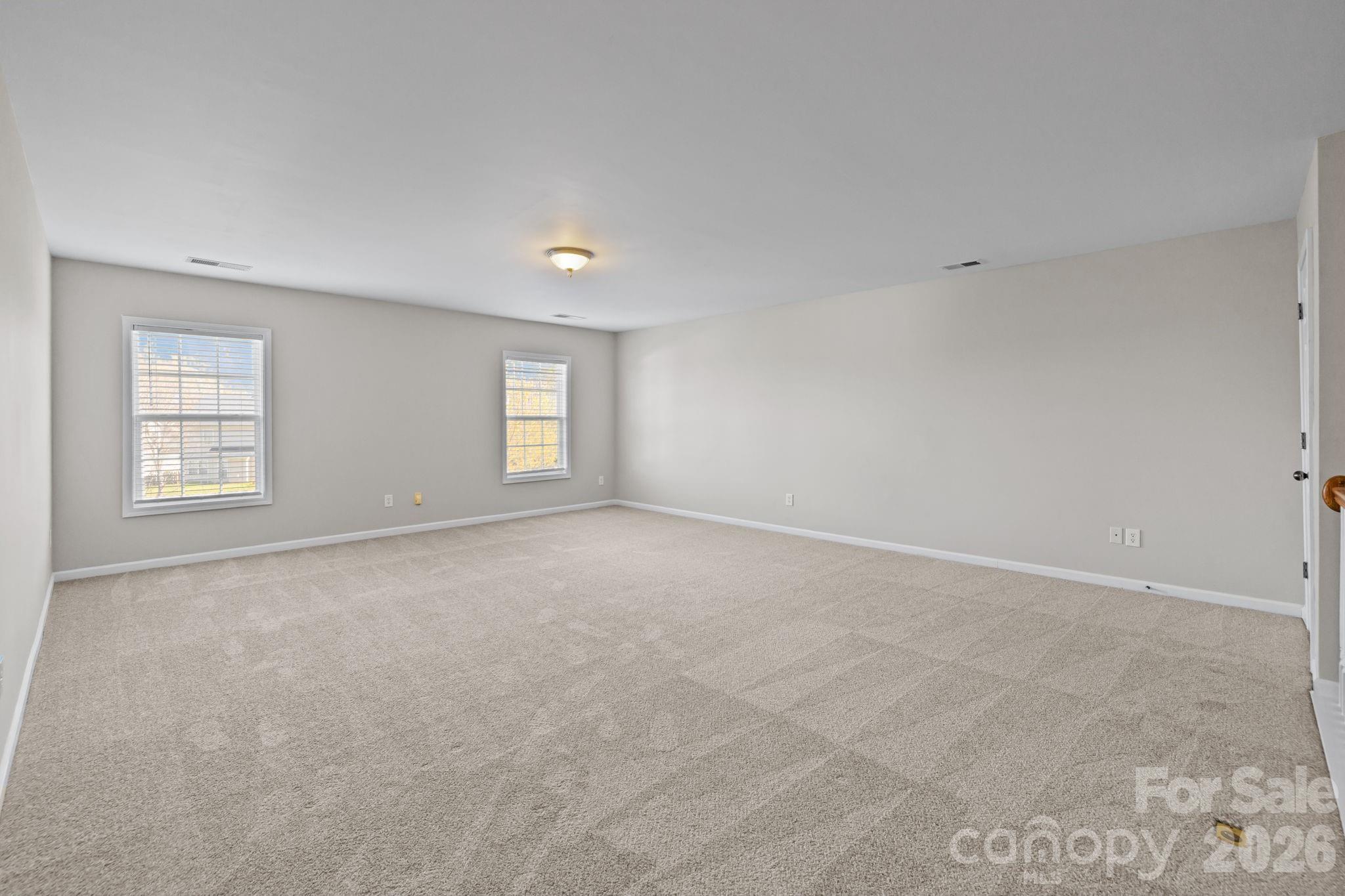 6226 Hermsley Road Charlotte, NC 28278 - Photo 20 of 47 an empty room with windows