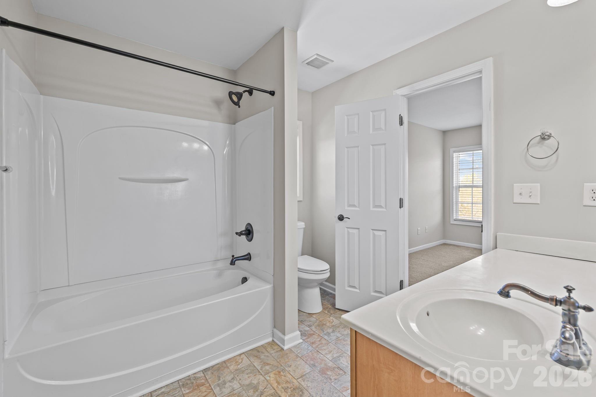 6226 Hermsley Road Charlotte, NC 28278 - Photo 25 of 47 a bathroom with a tub sink and mirror