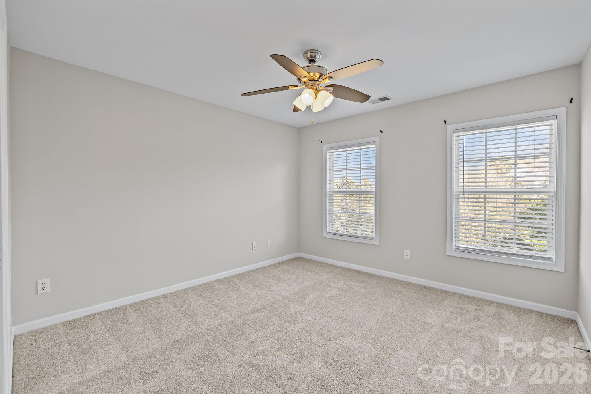 6226 Hermsley Road Charlotte, NC 28278 - Photo 37 of 47 a view of an empty room with a window