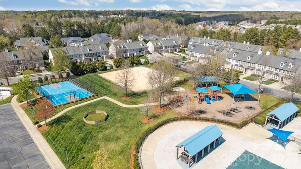 an aerial view of a house with a swimming pool
