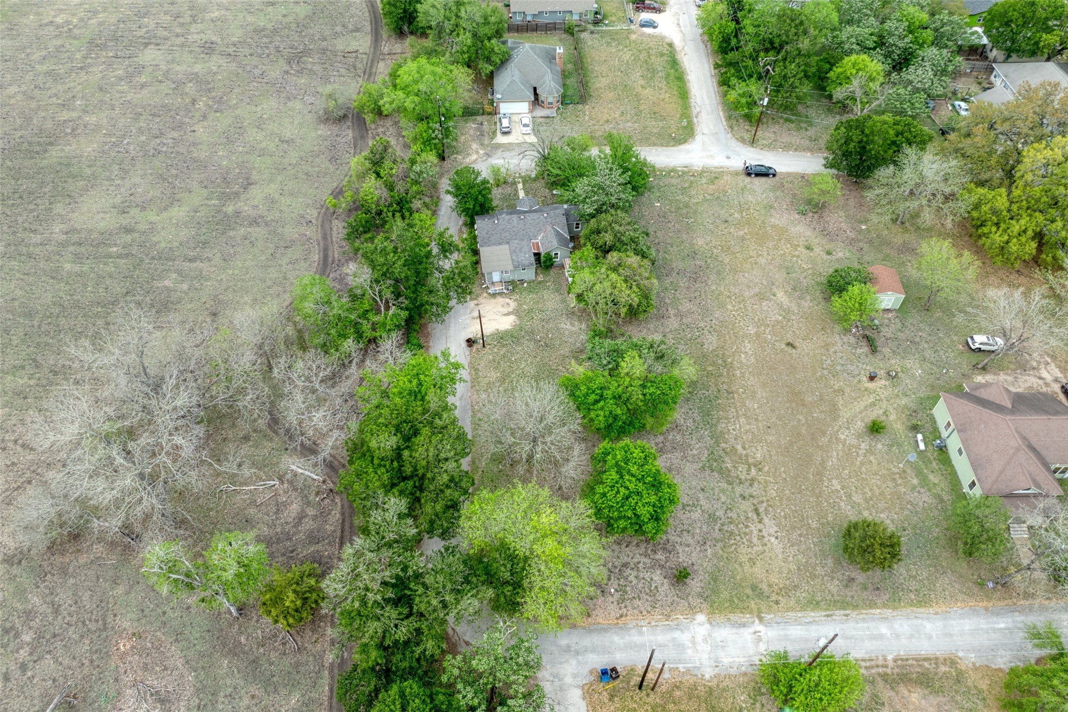 1006 Proctor Street Lockhart, TX 78644 - Photo 17 of 24 an aerial view of a house with a yard and garden