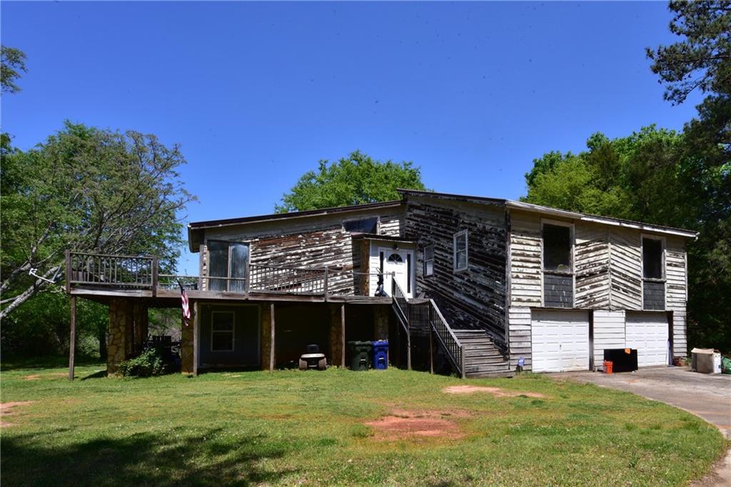 49 Cannon Farm Road Oxford, GA 30054 - Photo 1 of 1 a view of a house with a yard and a large tree