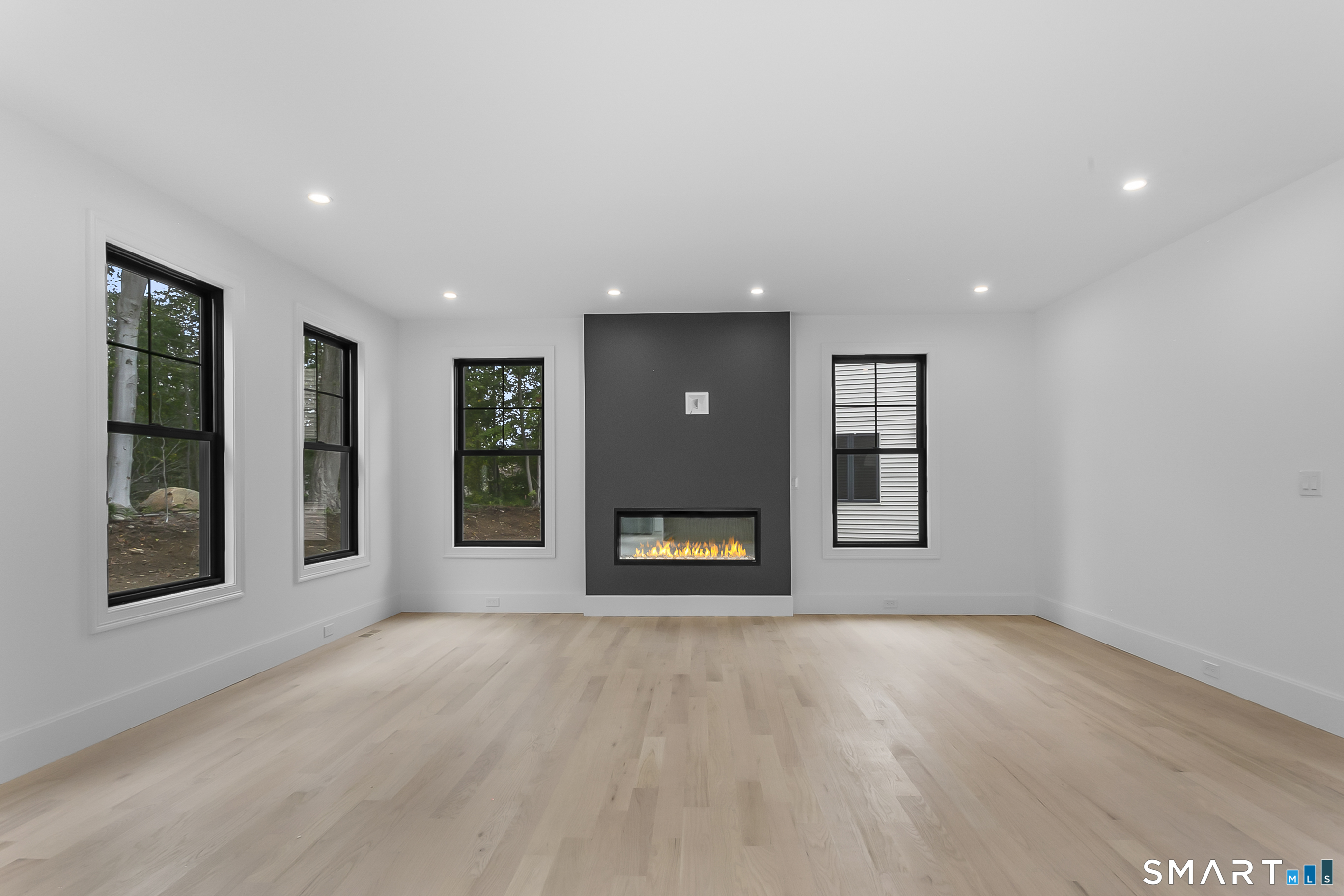 80 Oronoque Hills Road Stratford, CT 06614 - Photo 13 of 31 an empty room with window and fireplace