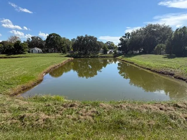 a view of a lake with a big yard