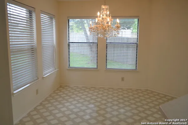 a view of closet area with empty racks