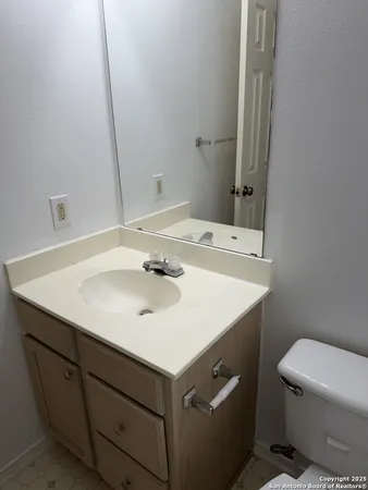 a bathroom with a sink and a window
