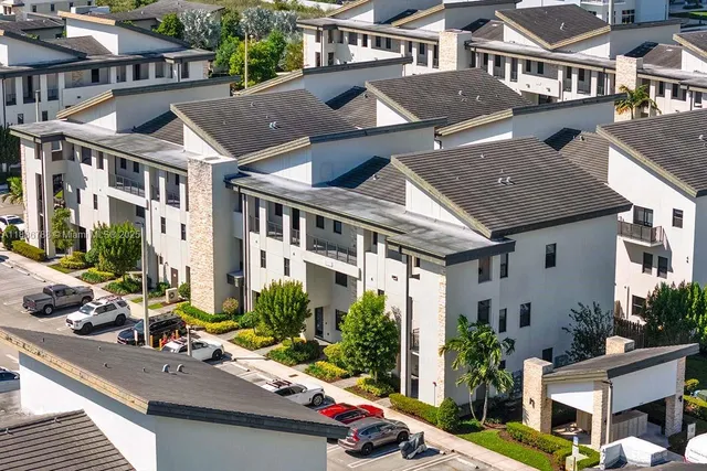a view of multiple houses with a street
