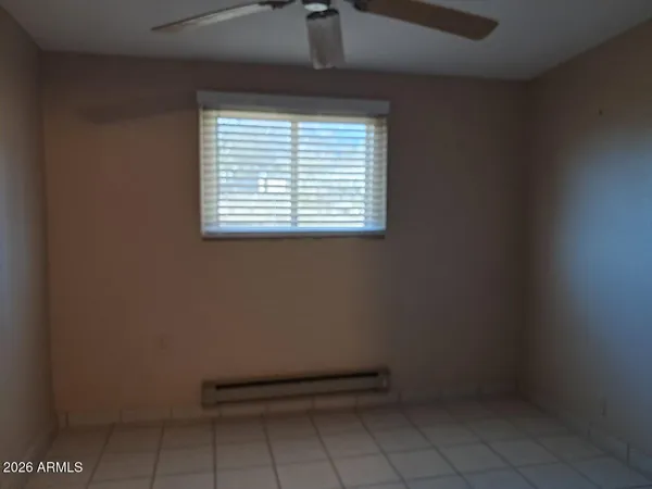 a view of a room with rack and fan