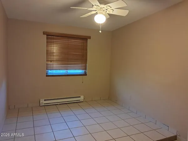 a view of a chandelier fan and entryway