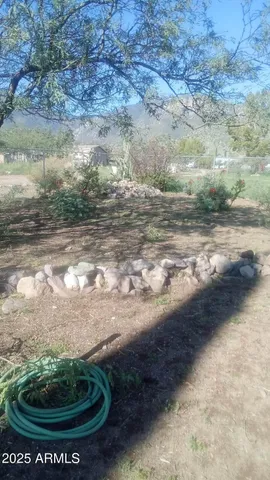 a view of a yard with an outdoor space