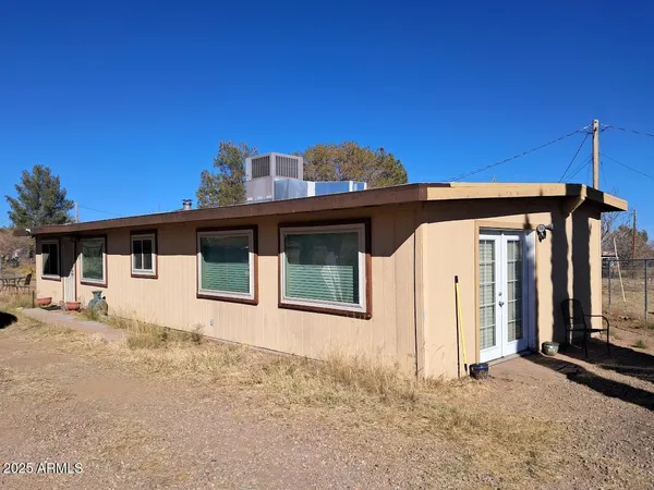 a front view of a house with a garage