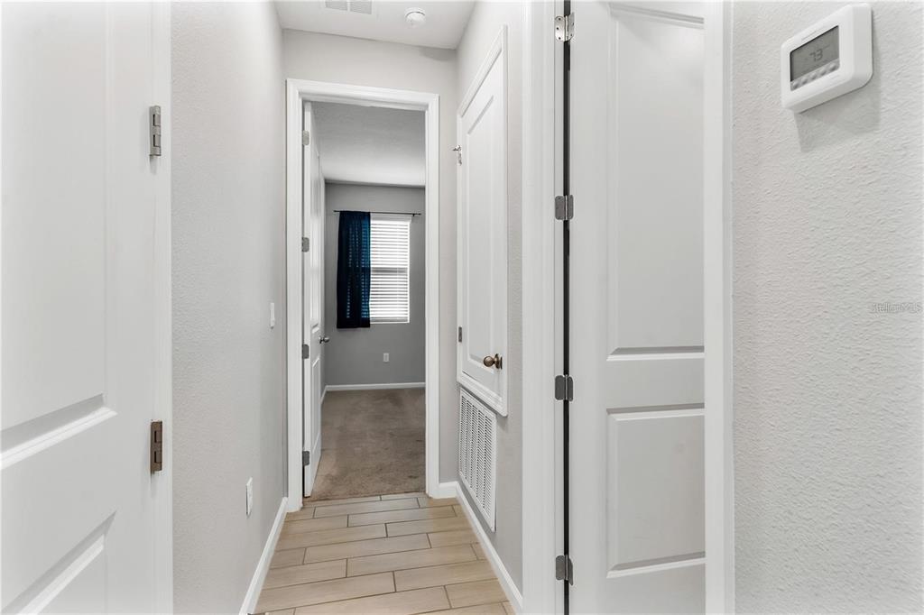 6003 Nightjar Court Leesburg, FL 34748 - Photo 17 of 41 a view of a bathroom from a hallway