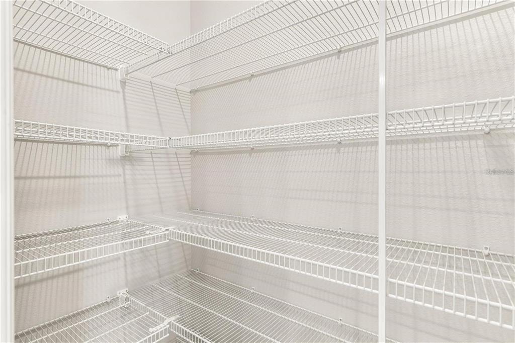 6003 Nightjar Court Leesburg, FL 34748 - Photo 20 of 41 a view of a room with racks on the wall