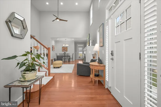 a living room with furniture a rug and a chandelier