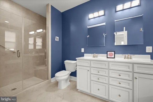 a bathroom with a sink double vanity and tub