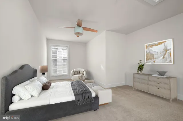 a bathroom with a sink a toilet a mirror and shower curtain