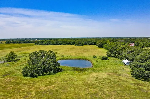 a view of a lake with a yard