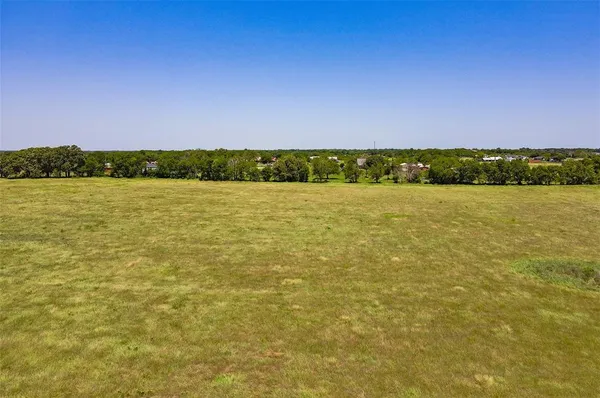 a view of a lake and a yard