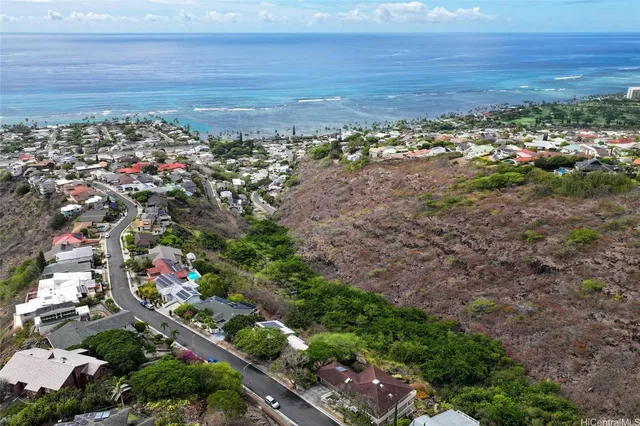 a view of a yard with an ocean
