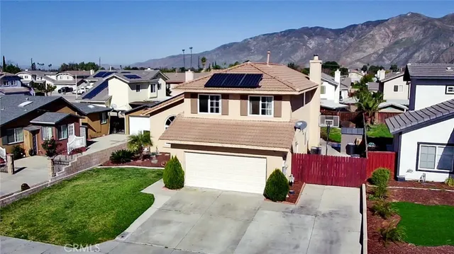 an aerial view of a house with a garden and plants