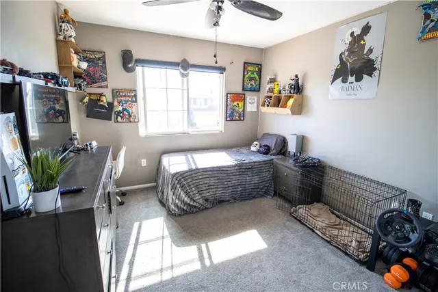 a bedroom with furniture and a window