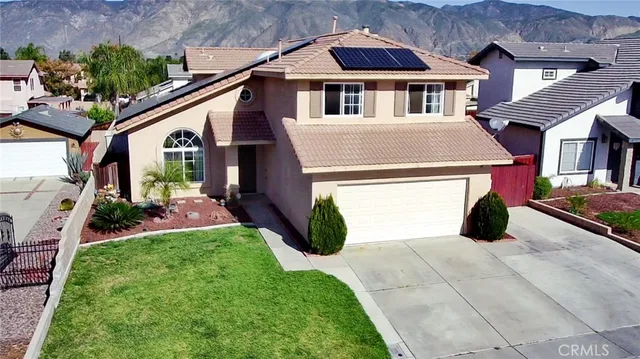 a view of house with yard