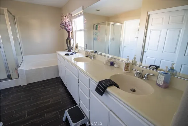 a bathroom with a double vanity sink and a bathtub