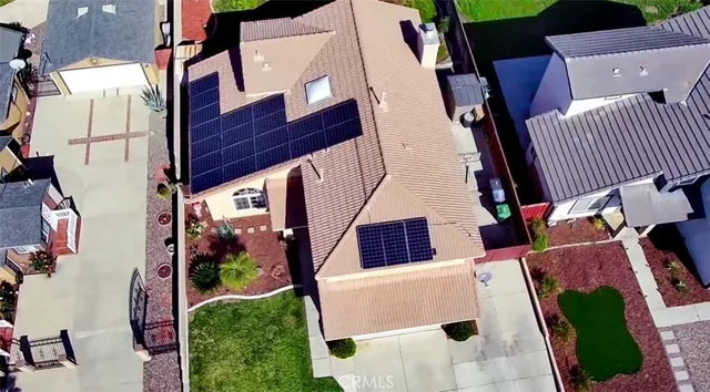 an aerial view of house with pool