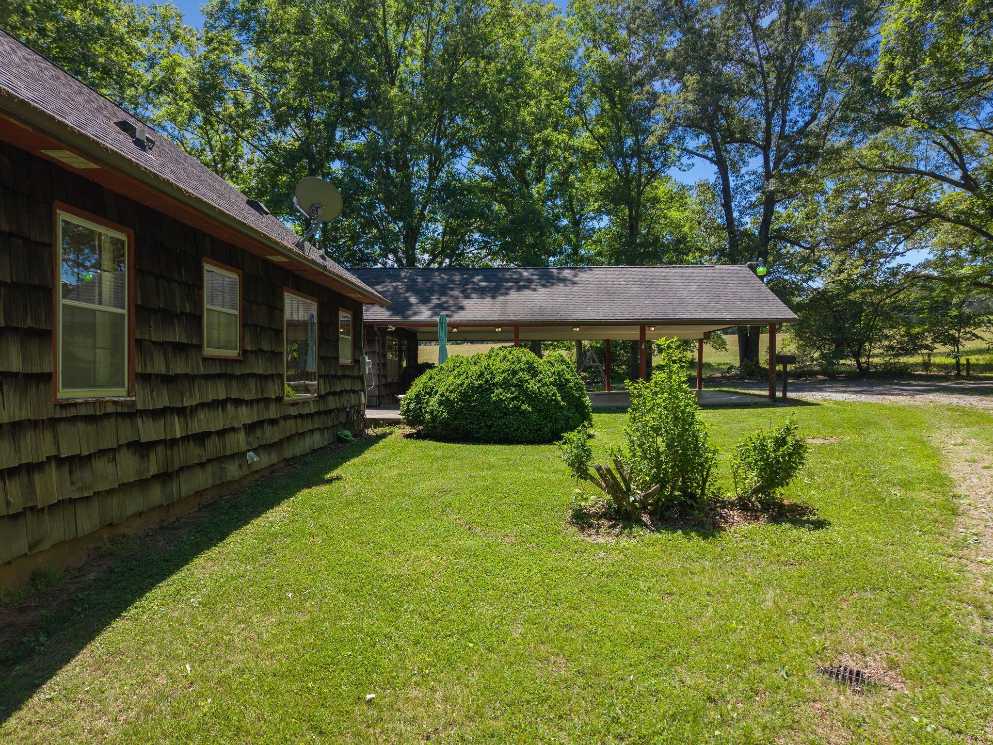 1115 Robin Ridge Road Henry, VA 24102 - Photo 34 of 54 a view of a backyard with plants