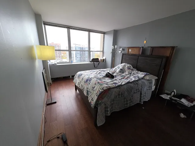 a bedroom with a bed furniture and a window