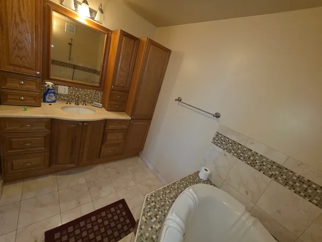 a bathroom with a sink and a shower curtain