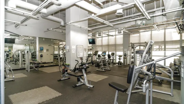 a view of tall buildings and a fountain