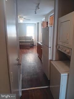2025 South 3rd Street, Unit 2 Philadelphia, PA 19148 - Photo 5 of 8 a view of a refrigerator in kitchen and empty room