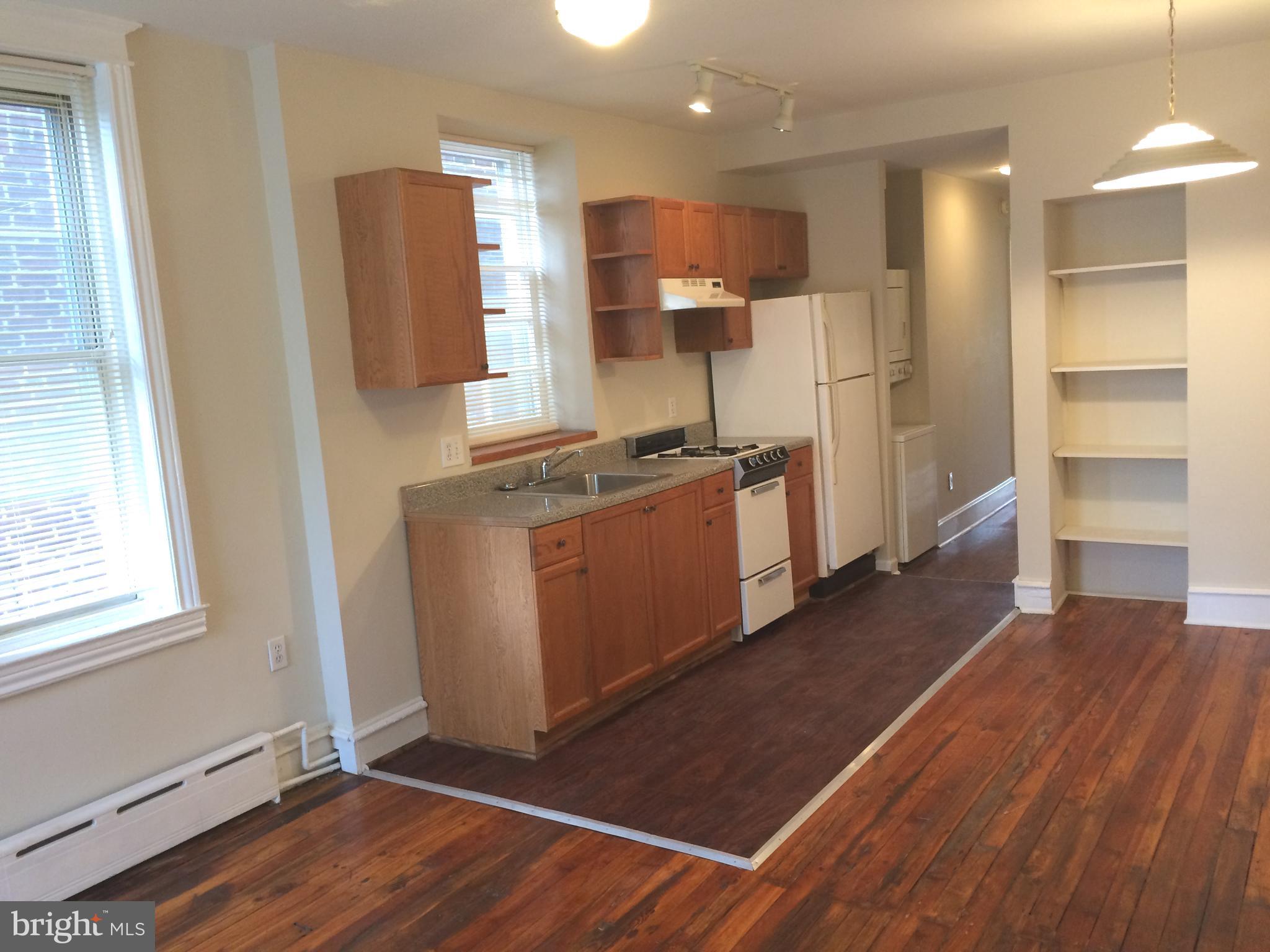 2025 South 3rd Street, Unit 2 Philadelphia, PA 19148 - Photo 8 of 8 a kitchen with stainless steel appliances granite countertop a refrigerator a sink and a stove
