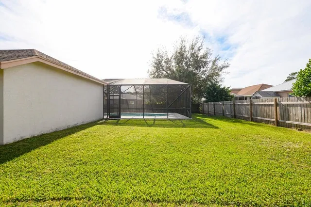 a view of a backyard with a small pool