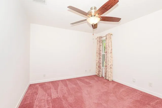 a view of a small space with wooden floor