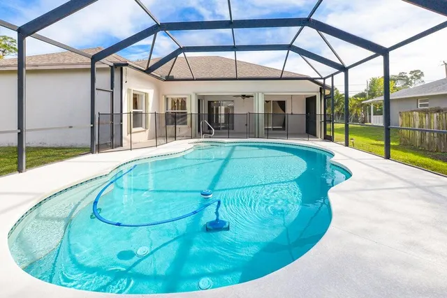 a view of a house with swimming pool