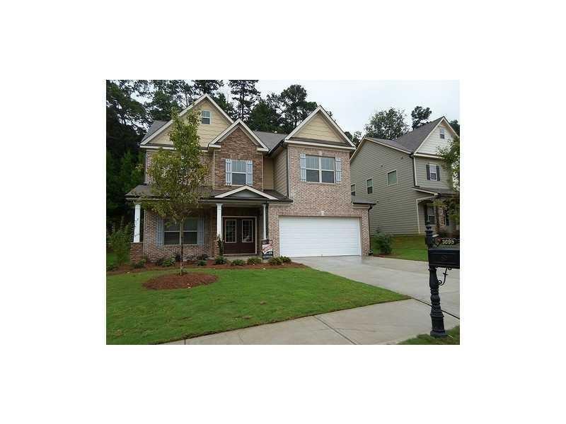 a view of a front of house with a yard