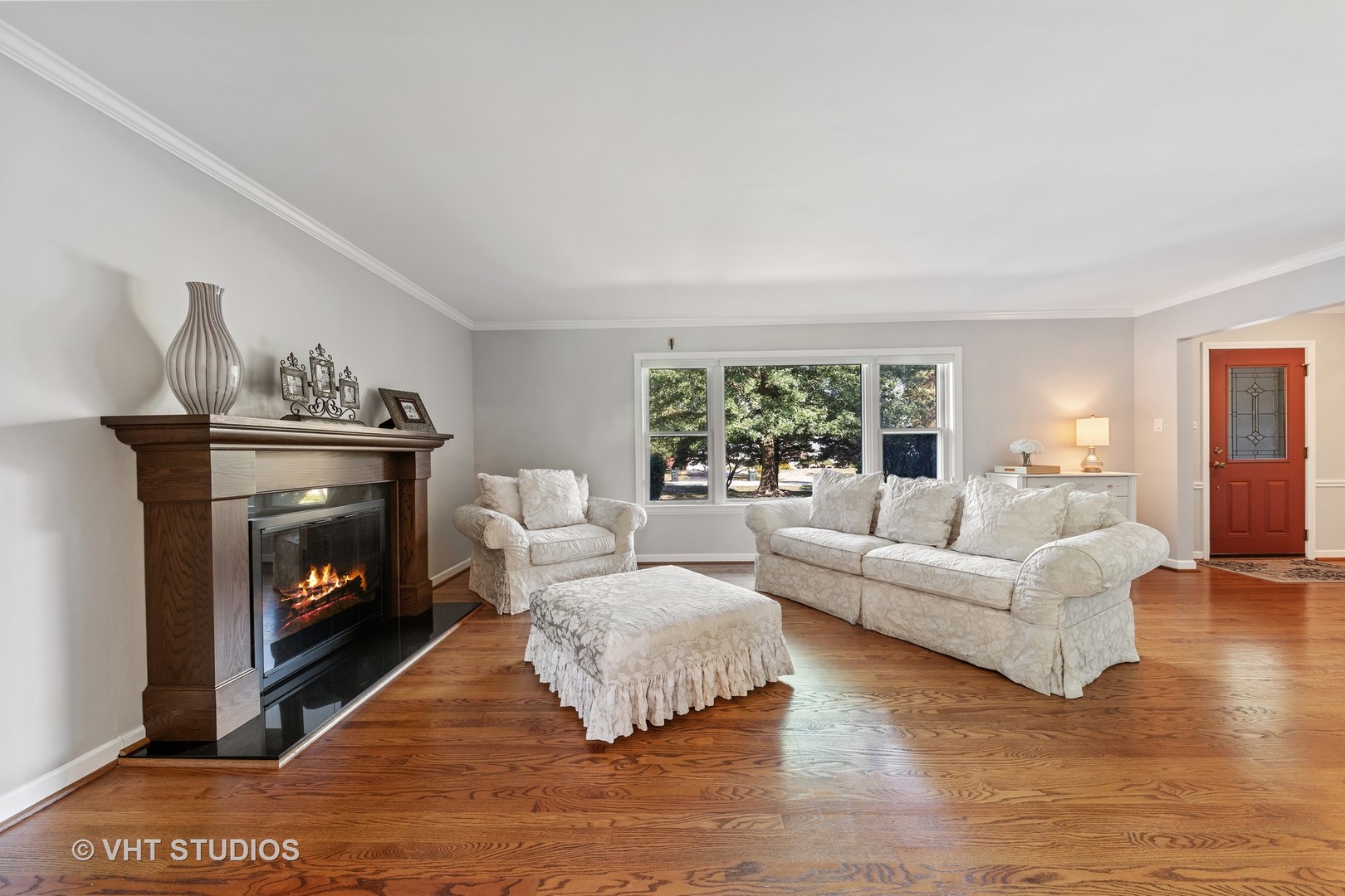 1108 Woodview Road Burr Ridge, IL 60527 - Photo 11 of 29 a living room with furniture and a fireplace
