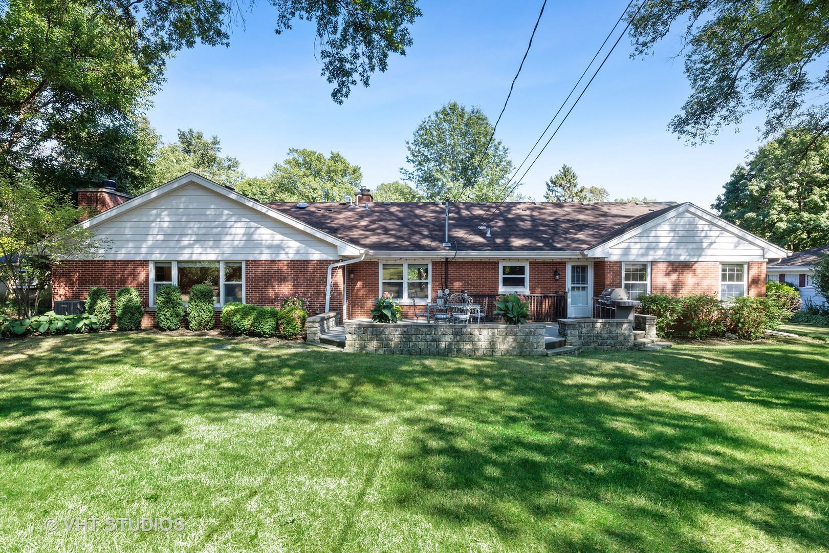 1108 Woodview Road Burr Ridge, IL 60527 - Photo 23 of 29 a front view of a house with garden and porch