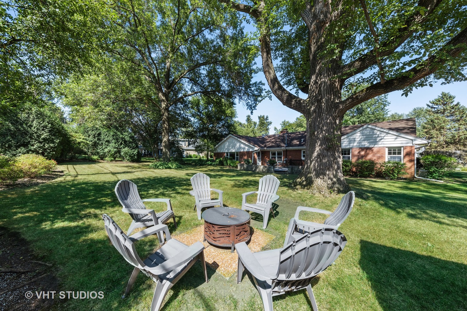 1108 Woodview Road Burr Ridge, IL 60527 - Photo 24 of 29 a view of a chairs and table in the garden