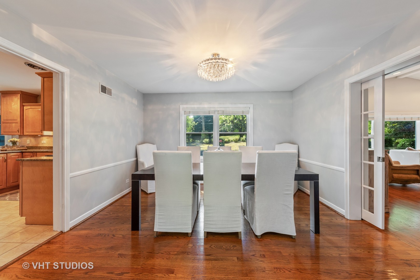 1108 Woodview Road Burr Ridge, IL 60527 - Photo 6 of 29 a view of a dining room with furniture window and wooden floor