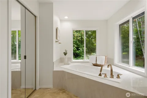 a bathroom with a tub and a sink