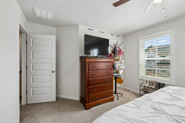 a bedroom with a bed and furniture