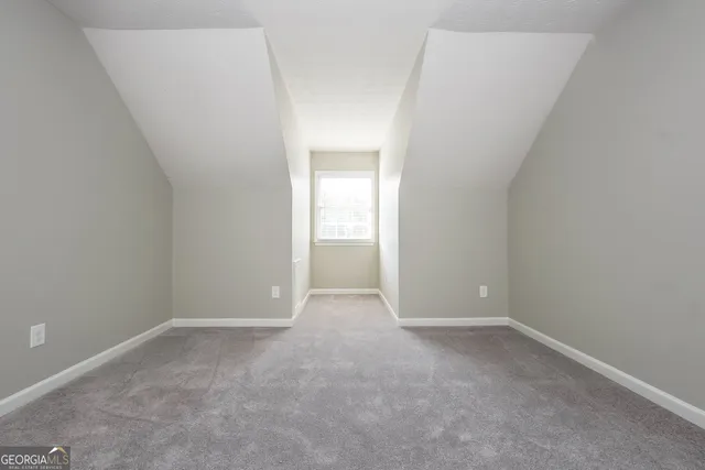 a view of an empty room and closet