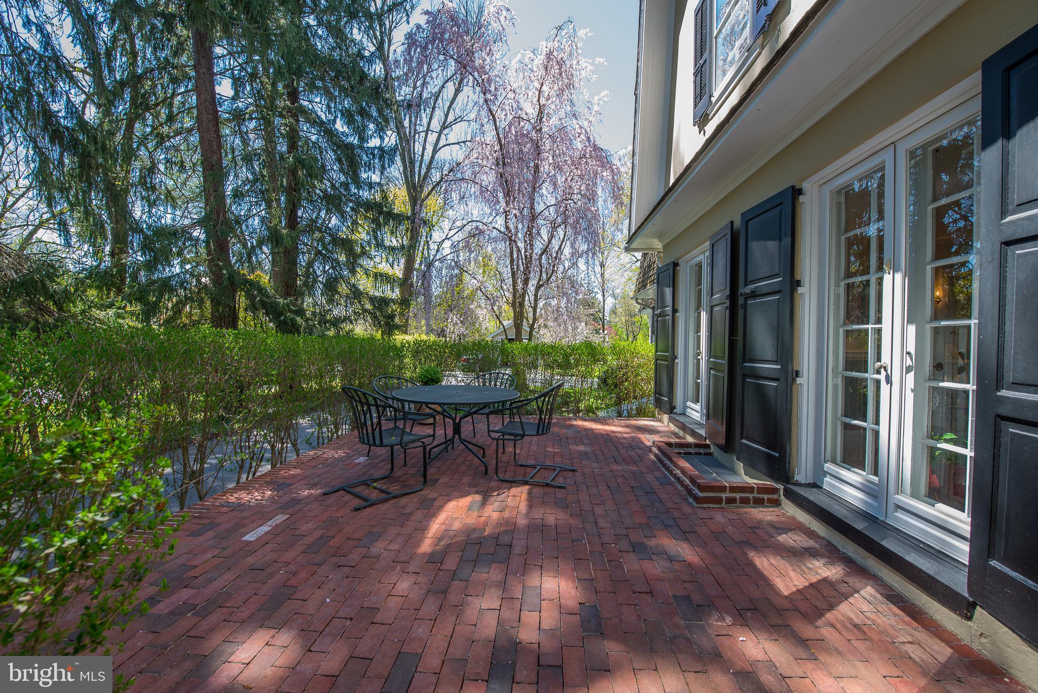 418 Dorset Road Devon, PA 19333 - Photo 40 of 54 Brick Patio with privacy hedge off Dining Room