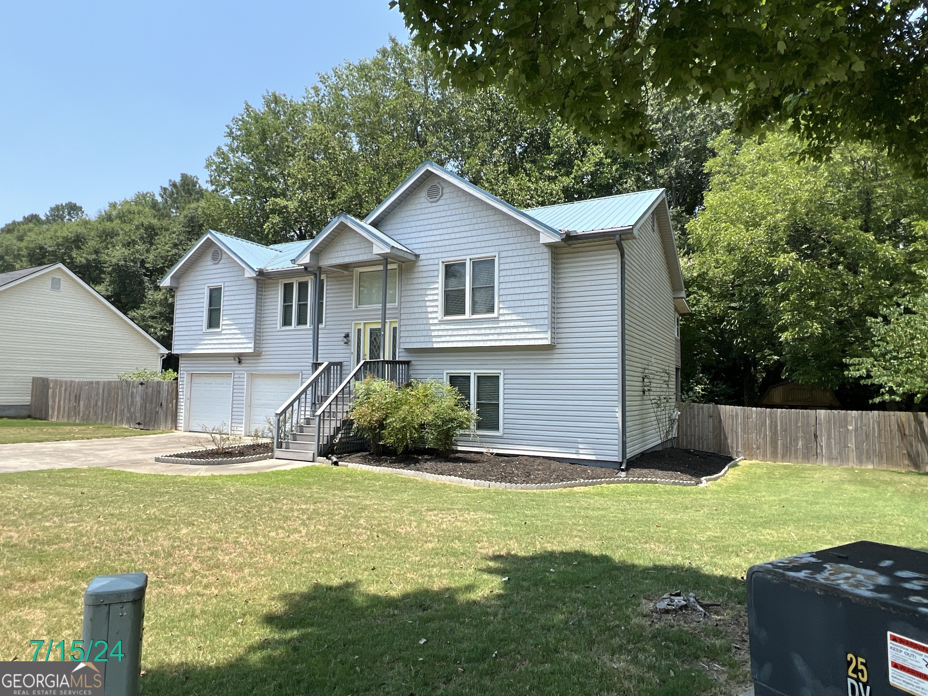 320 Harrison Lane Winder, GA 30680 - Photo 1 of 1 a view of a house with a yard and large tree