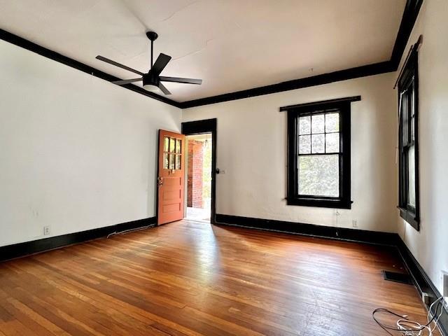 378 9th Street Northeast, Unit 1 Atlanta, GA 30309 - Photo 4 of 9 a view of an empty room with wooden floor and a window
