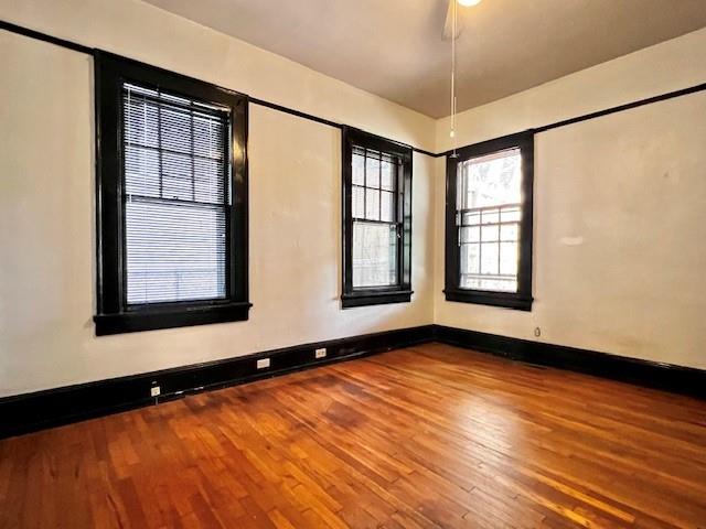 378 9th Street Northeast, Unit 1 Atlanta, GA 30309 - Photo 7 of 9 a view of an empty room with window and wooden floor
