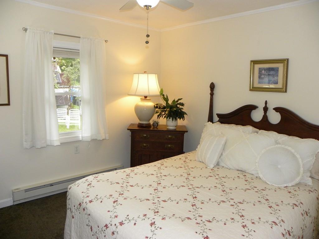 66 Osgood Road Charlton, MA 01507 - Photo 11 of 42 a bedroom with a bed and wooden floor